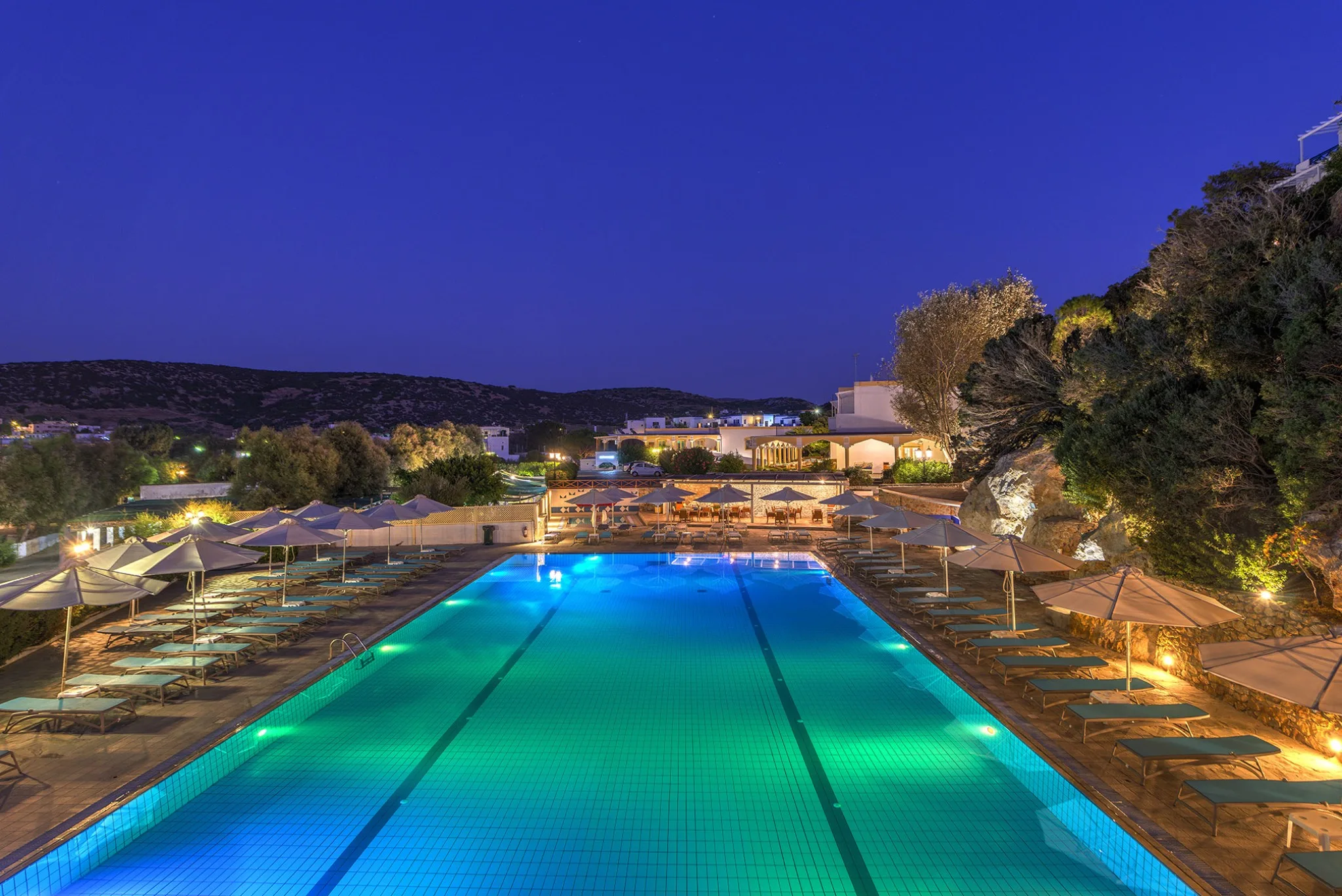 dolphin-bay-seaside-resort-spa-siros-pool-by-night